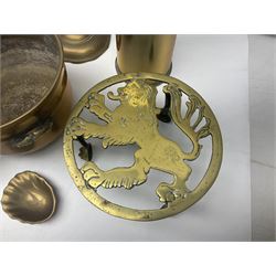 Collection of brassware, to include two jardinieres, candle sticks, brass shell, etc