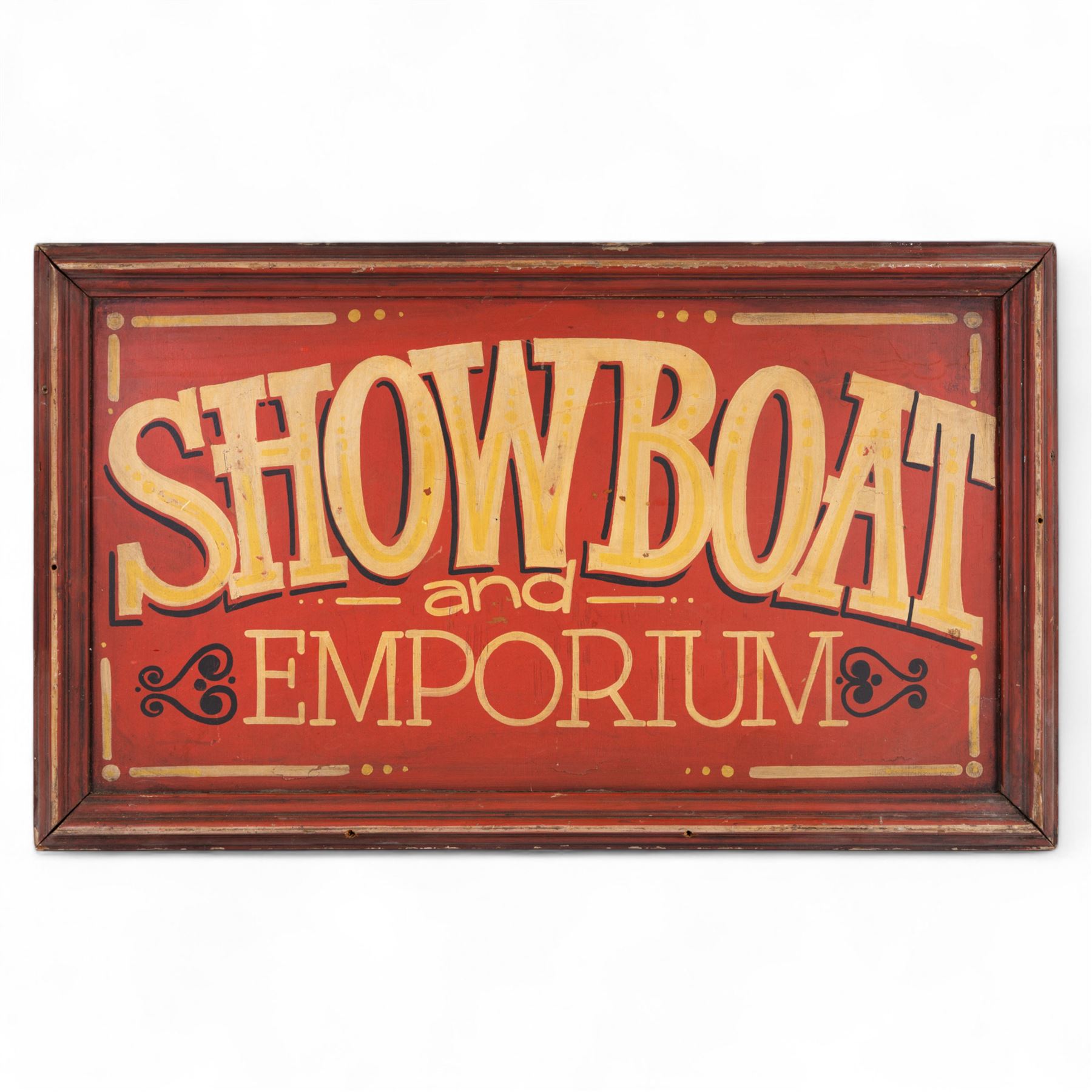 'Showboat and Emporium' painted wooden sign, yellow lettering on a red ground, H54cm, W91cm