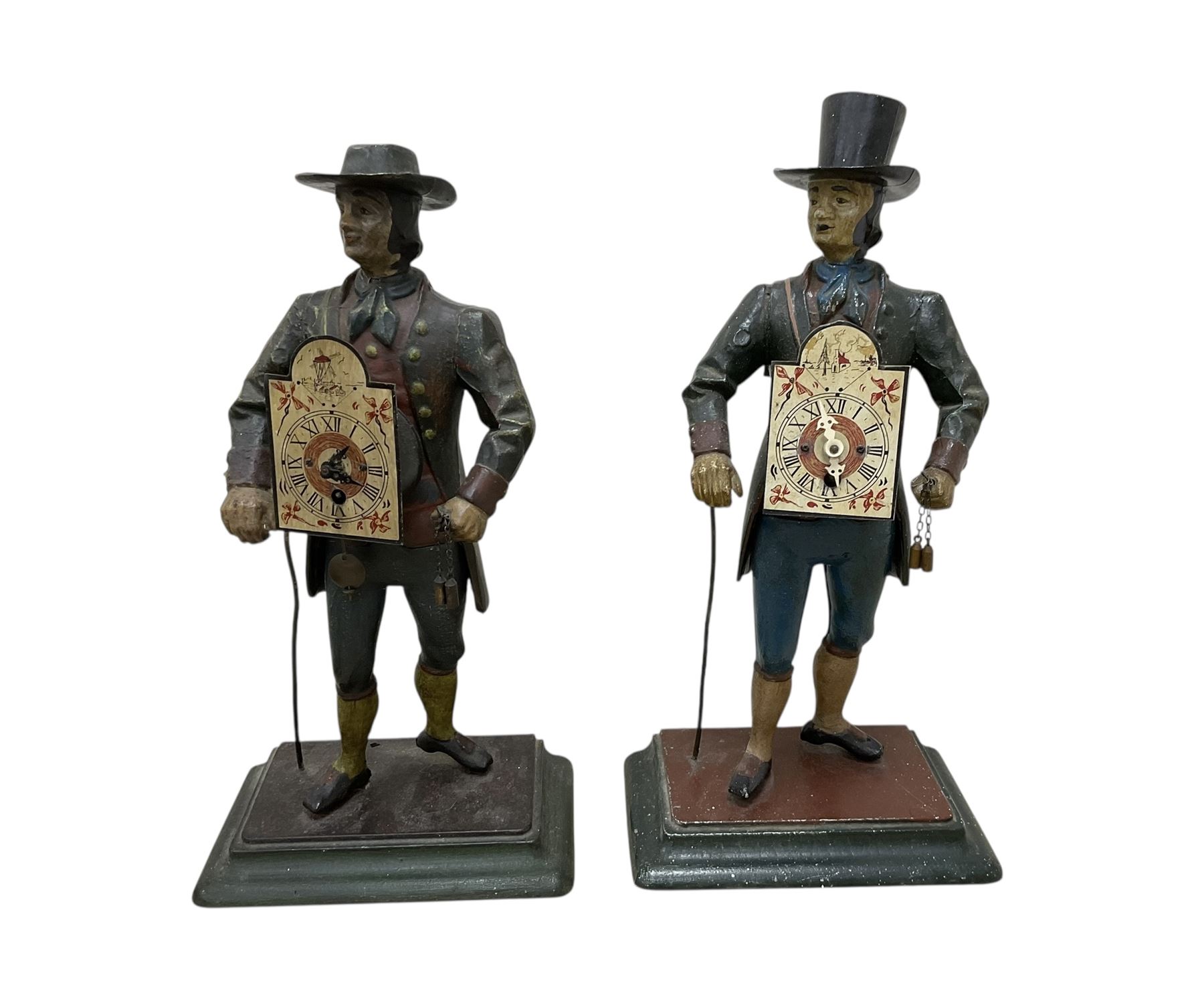 Two 29th century reproduction German traveling clockmaker figures and a small battery operated miniature lantern clock
