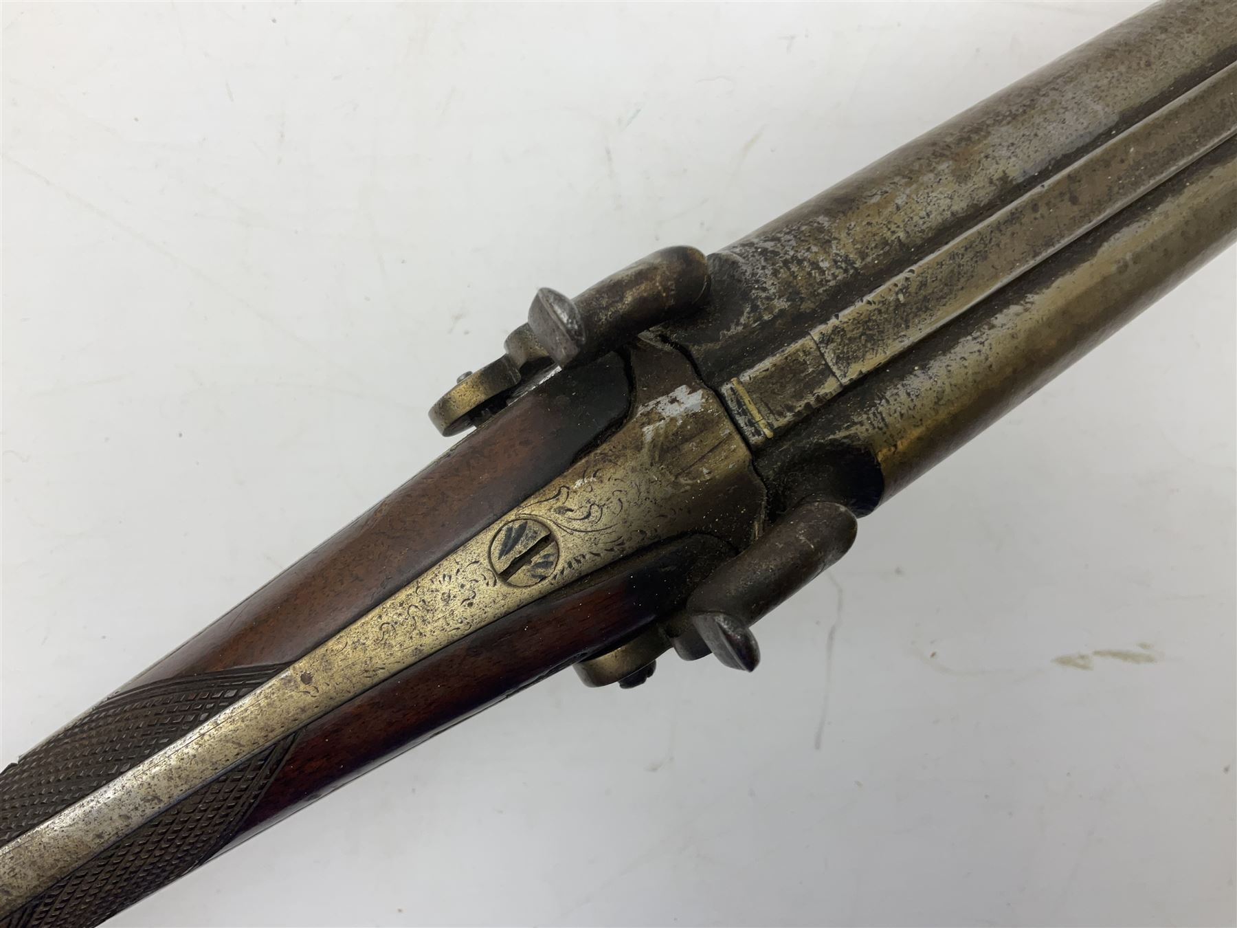 19th century 13-bore double barrel side-by-side percussion cap shotgun, the 72cm stub twist damascus barrels with ramrod under, walnut stock with chequered grip L117.5cm overall