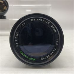 Seven camera lenses, including 'Pentacon 4/300' lens, serial no 8613038, 'Hoya HMC Zoom 28-85mm 1:4' lens serial no 215421, Minolta MD zoom 70-210mm 1:4' lens serial no 1022848, etc 