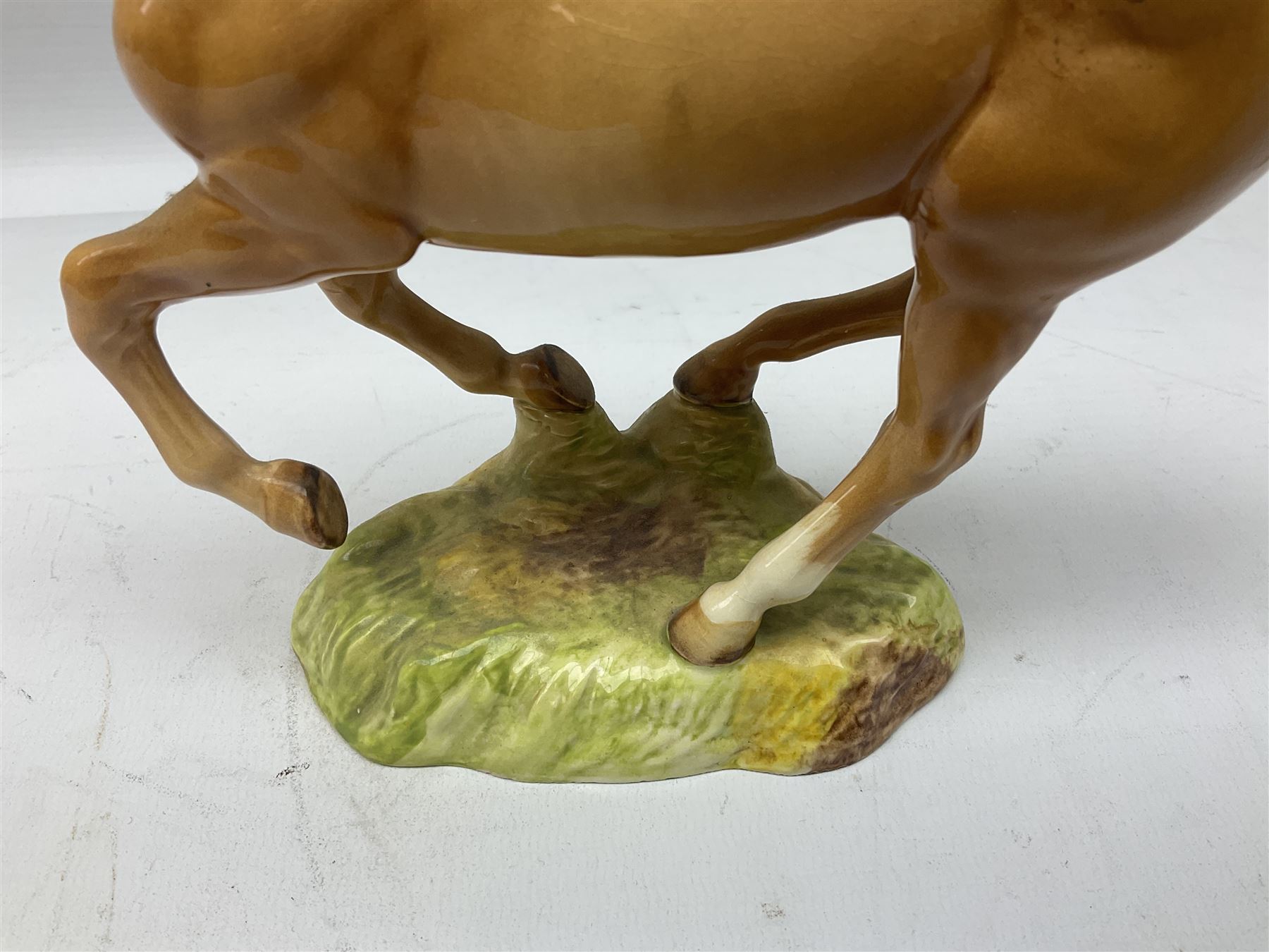 Beswick figure of cantering Palomino horse on base model no 1374, with impressed and printed mark beneath, H18cm