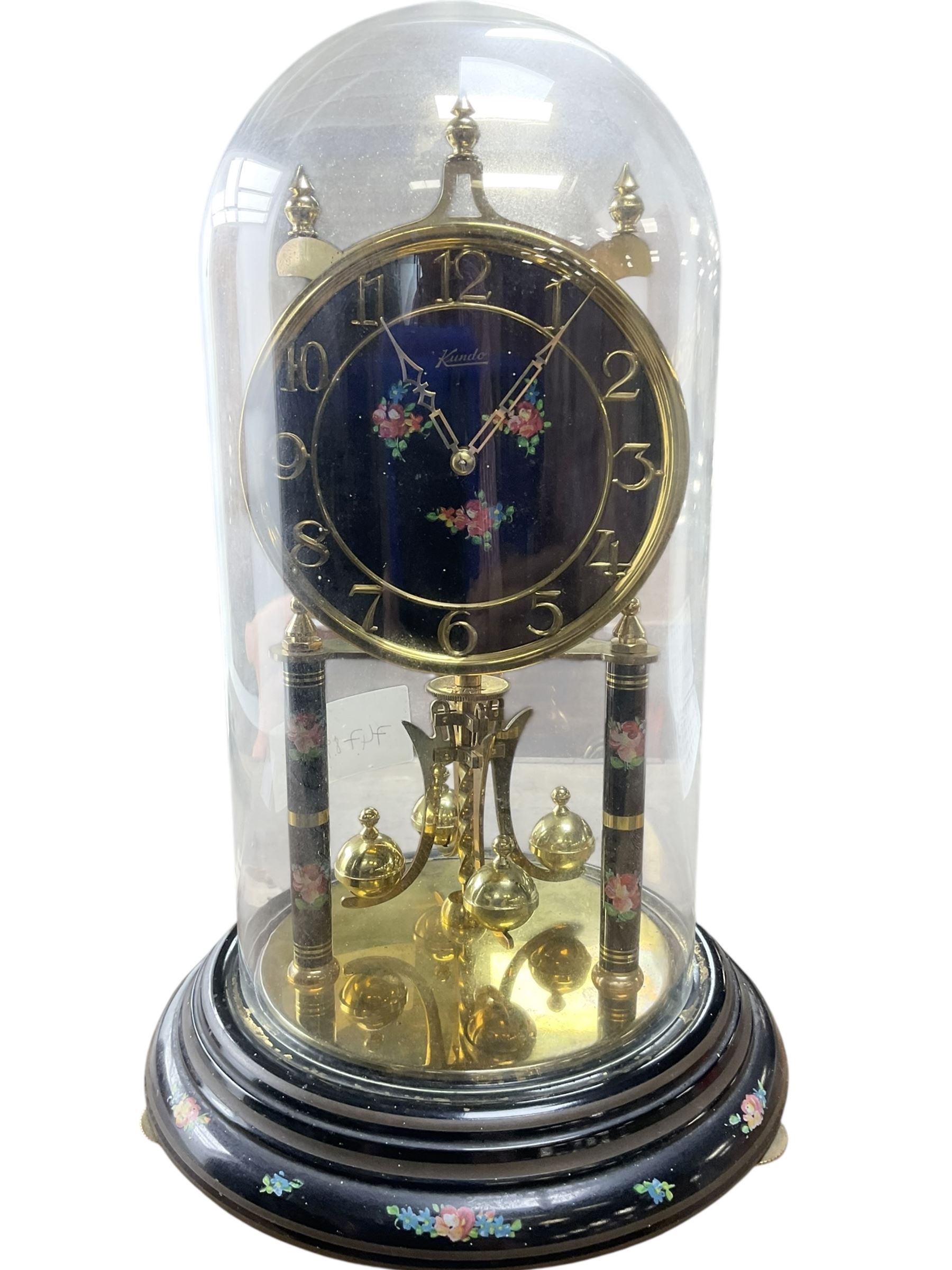 Kundo 1960's torsion clock with a skeleton movement and four ball
