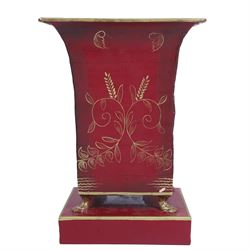 19th century toleware vase, painted foliage and corn upon a red ground, on four paw feet a...