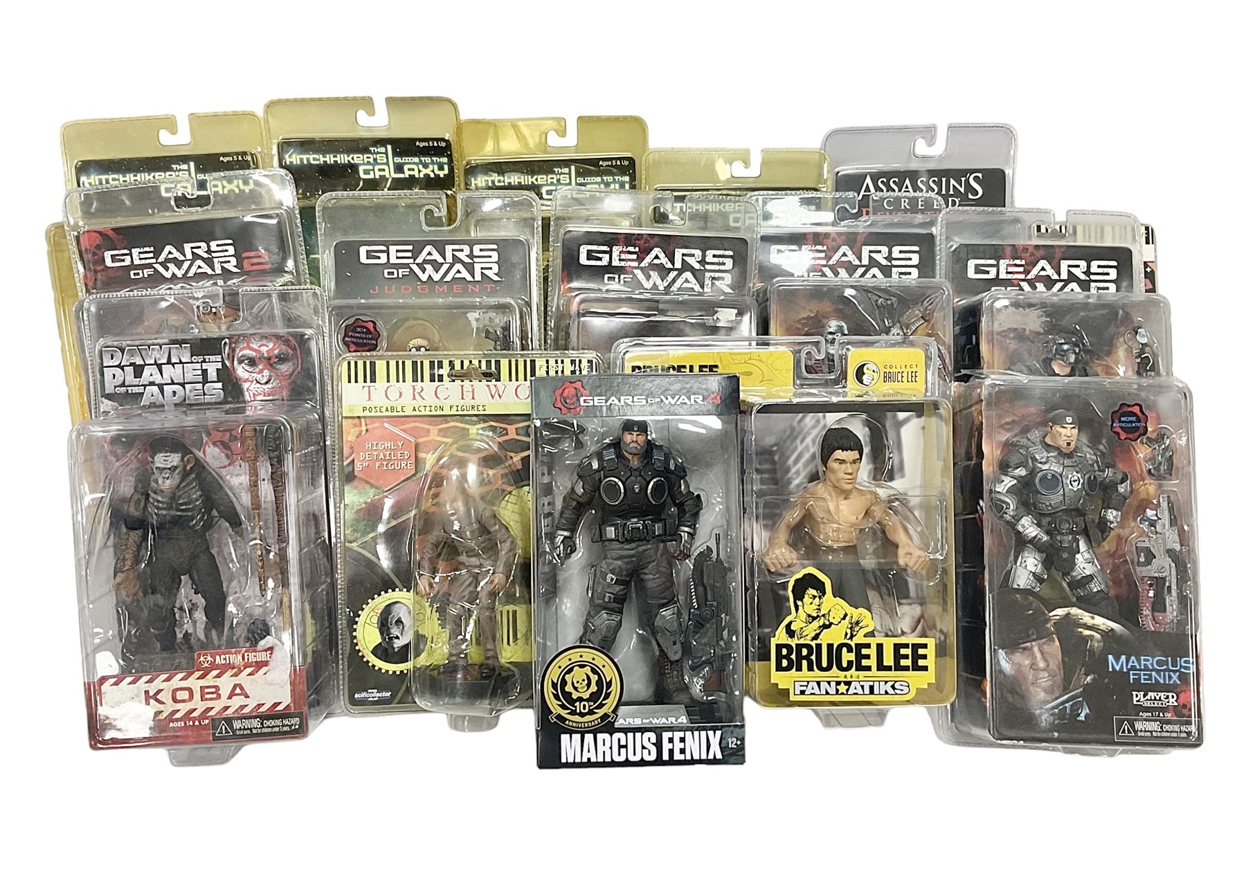 Sixteen carded action figures comprising seven 'Gears of War'; four 'Hitchhikers Guide to the Galaxy'; two 'Torchwood'; 'Planet of the Apes'; 'Bruce Lee'; and 'Assassin's Creed'; all in unopened packs (16)