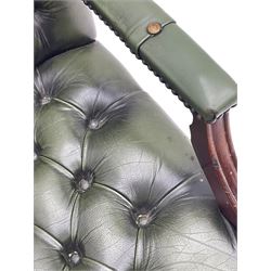 Georgian design swivel office desk chair, upholstered in buttoned green leather, on five spoke base with castors 