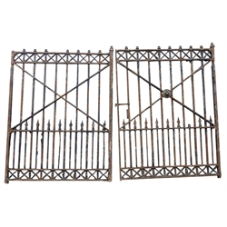  Pair of large cast iron Country House drive way gates, the square section uprights with urn and arrow finials, with X pierced cresting, each H234cm, W172cm (2)  