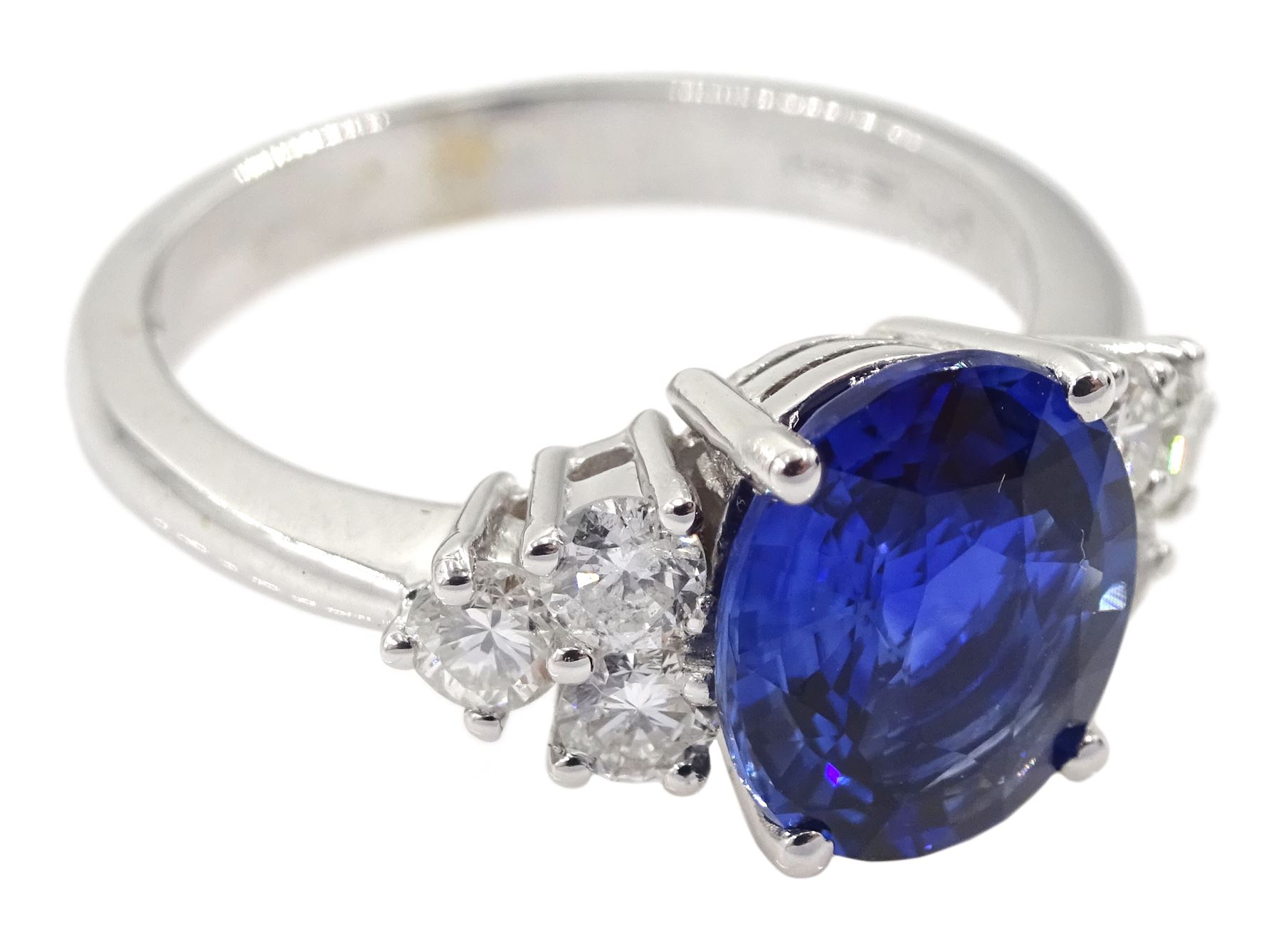 18ct white gold fine oval Ceylon sapphire and six round brilliant cut diamond ring, hallmarked, sapphire approx 2.50 carat, total diamond weight approx 0.50 carat