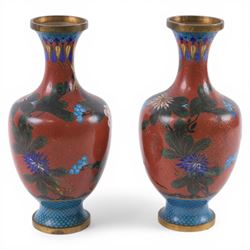 Pair of Chinese cloisonne vases, each of baluster form, decorated with blossoming peonies upon a red ground, H23.5cm