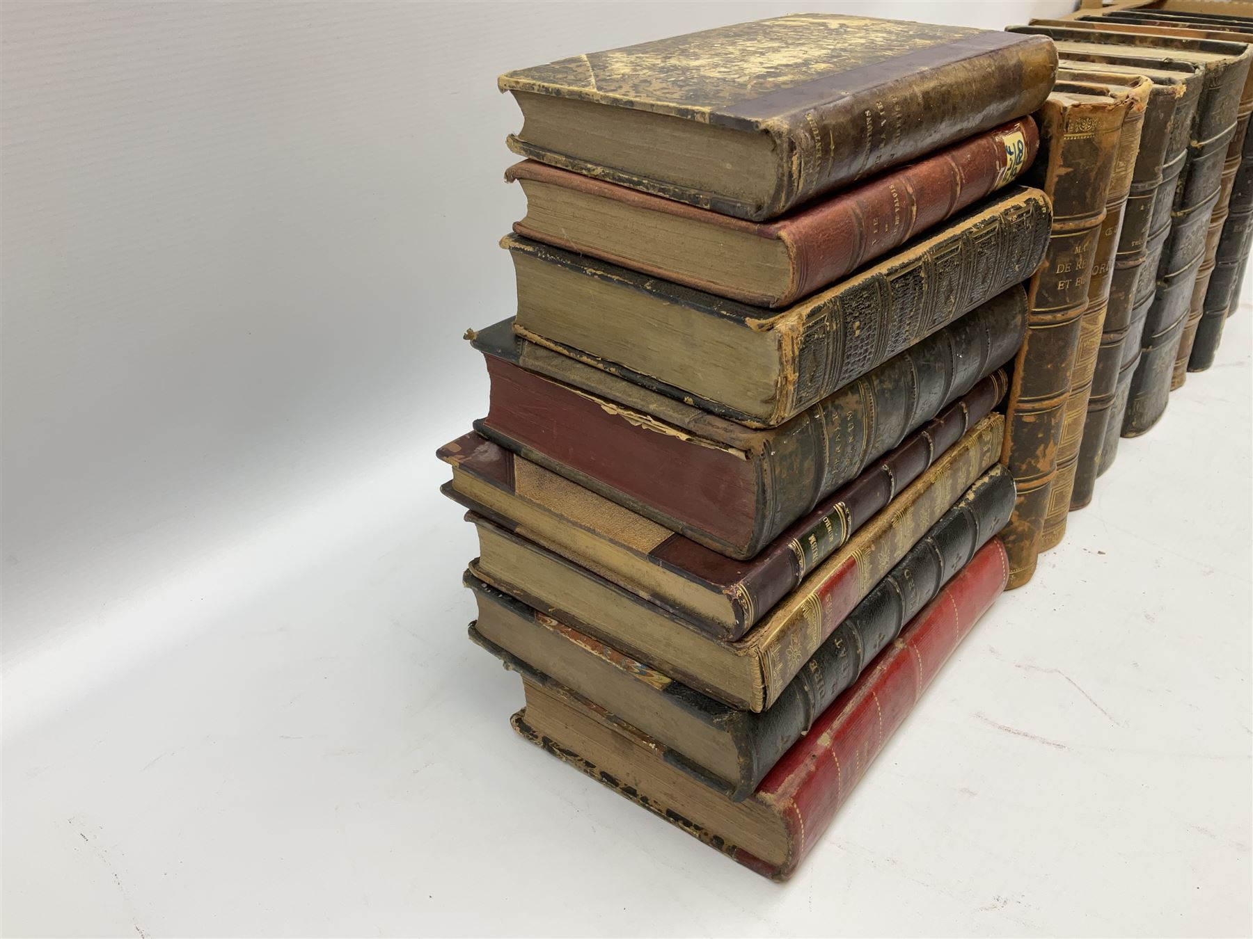 Eighteen 19th century leather bound books including Oeuvres Completes De Voltaire. 1827 Paris. Two volumes; Oeuvres De Pierre Corneille. 1892 Paris; Commentarium in Librum Geneseos Scripsit Thomas Josephus Lamy. 1883 Mechliniae; etc (18)