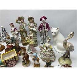 Quantity of composite and ceramic figures to include three Lilliput Lane models of cottages, continental figures, animal figures etc in two boxes