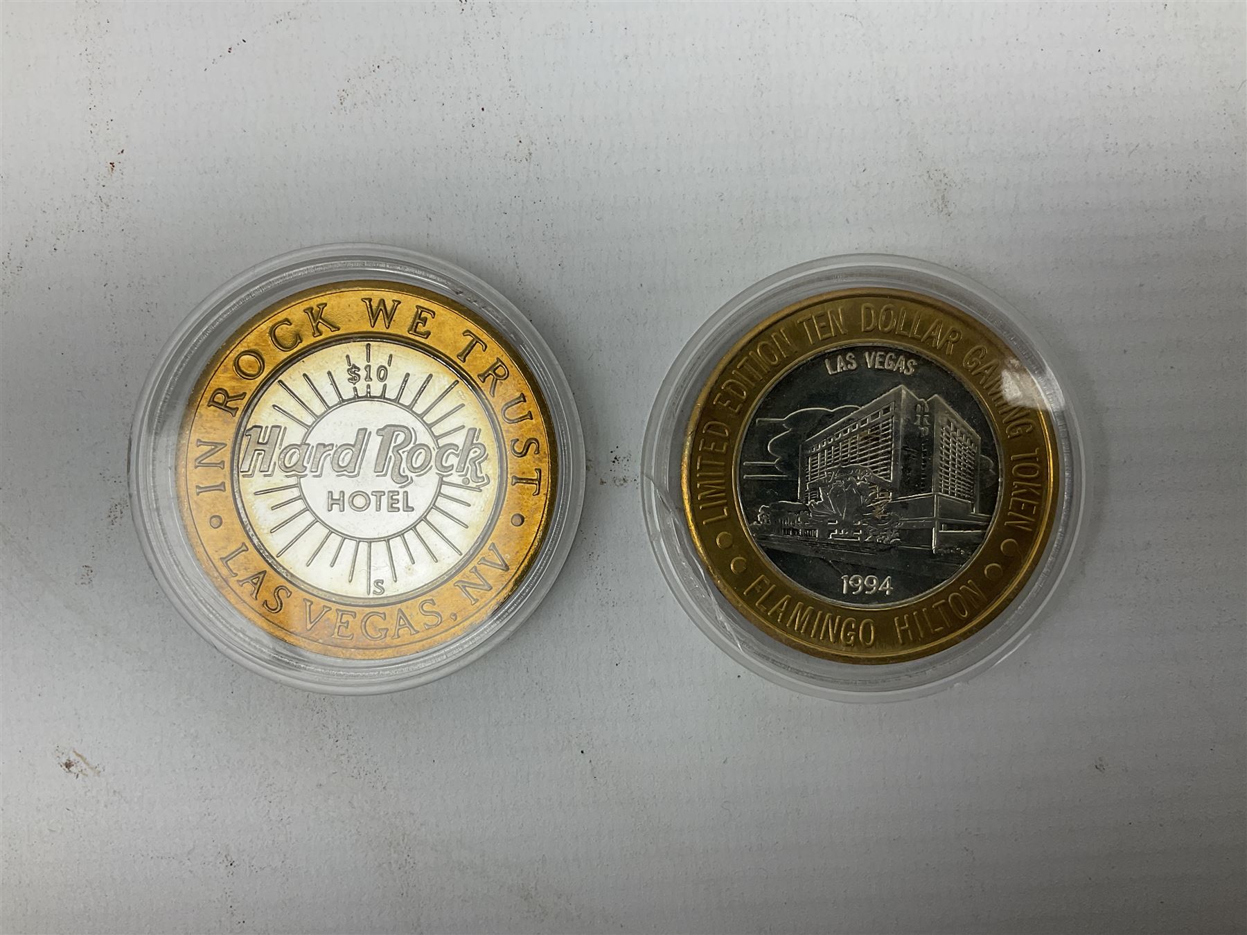 Eight Las Vegas limited edition ten dollar casino silver strike gaming tokens, consisting of a fine silver centre with brass outer ring (8)