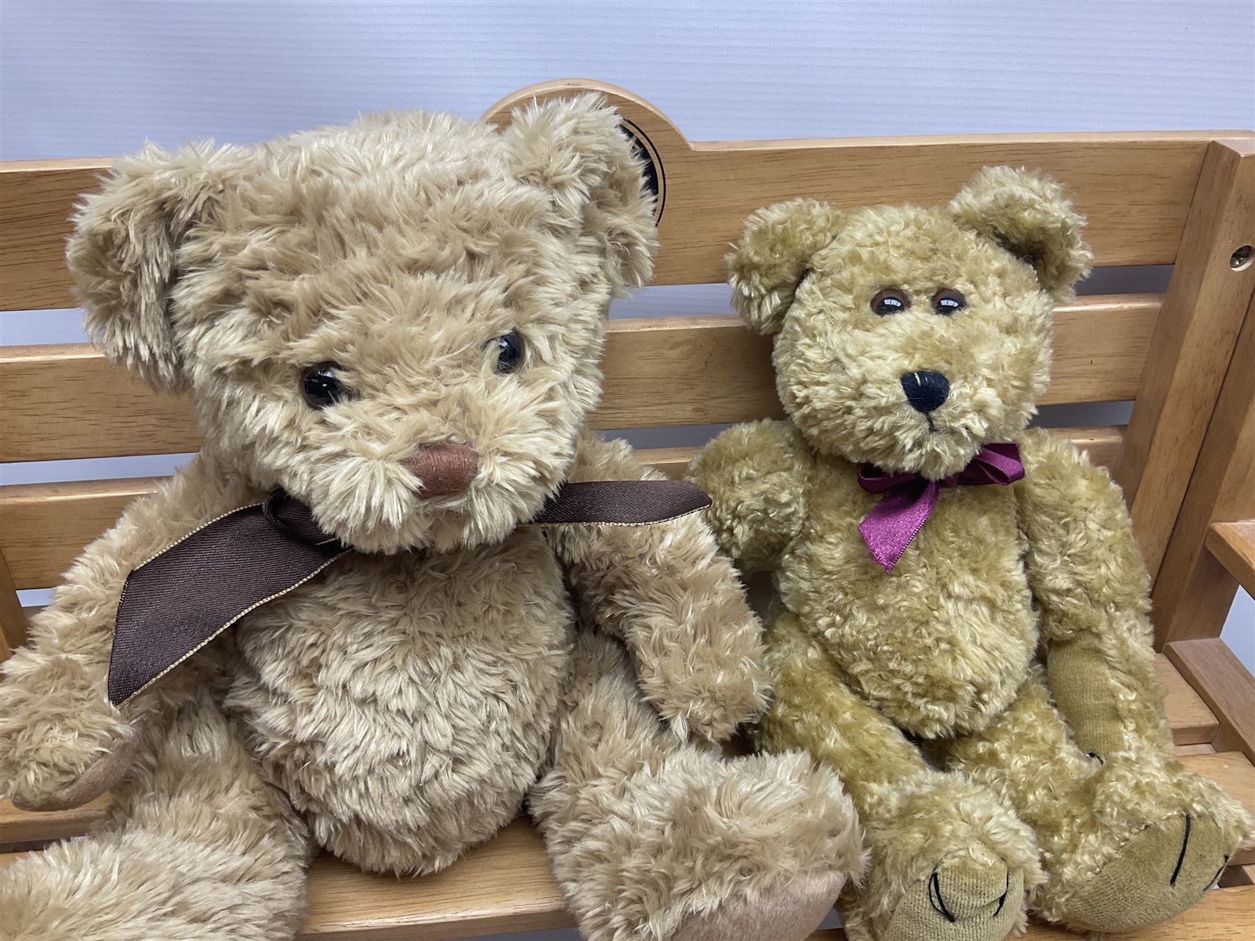 Charlie Bears bench, H41.5cm L58.5cm D29.5cm, and two Charlie Bears deck chairs, each approximately H37cm, together with a limited edition Silver Tag Bear, Logan Bear, 226/1,500, with tag, and two further bears, (6)