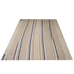 Handmade large patchwork quilt bedspread made up of individual squares of multi-coloured cottons and backed in a cream cotton, 243cm x 284cm 