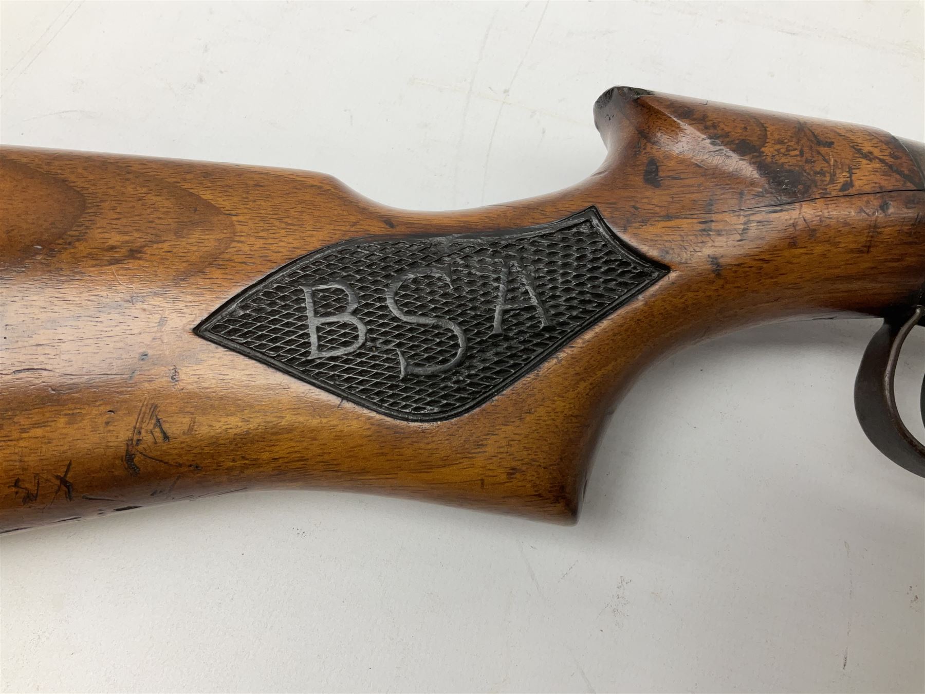BSA .177 air rifle with top loading under lever action, walnut stock carved with chequered BSA logo to grip, serial no.A1203 L102cm