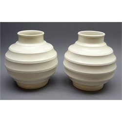  Pair of Keith Murray for Wedgwood off white Globe vases, with ribbed circular bodies, printed signature & marks, H16cm  