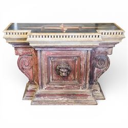 A 20th century Italian Neoclassical console table of monumental architectural form, inspired by Roman altar and sarcophagus prototypes; the rectangular marble top with dentil-moulded edge and polychrome geometric compass-star inlay, executed in contrasting marbles on a dark green ground, above a pedestal base of simulated stone finished in red porphyry-type tones, centred by a lion’s mask in relief and flanked by Ionic scroll volutes, raised on a stepped plinth base