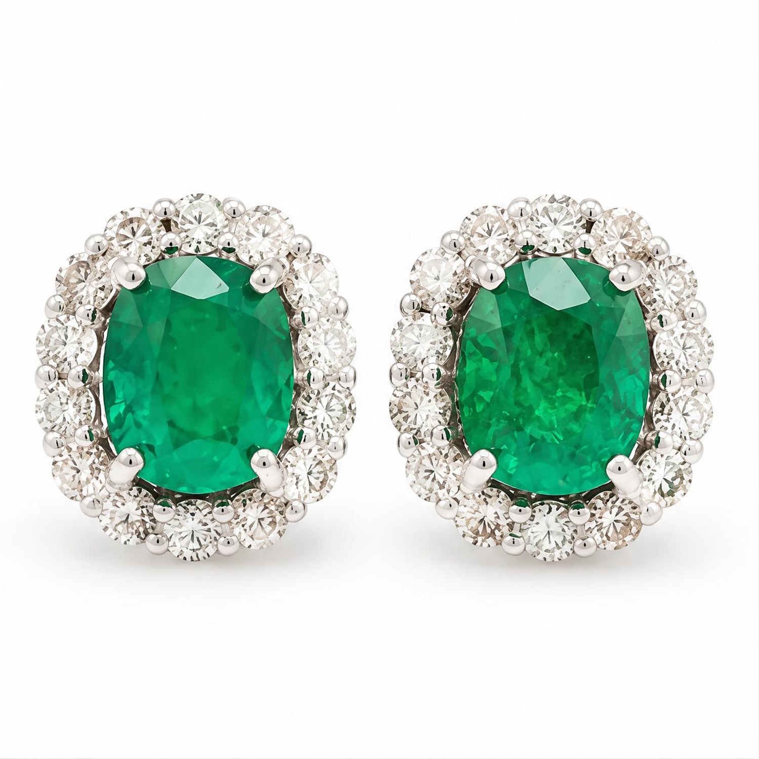 Pair of 18ct white gold emerald and diamond cluster earrings, each stud set with a cushion cut emerald surrounded by fourteen round brilliant cut diamonds, stamped, total emerald weight approx 2.50 carat, total diamond weight approx 0.65 carat