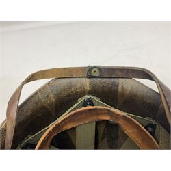 American first type paratrooper helmet with post-WW2 strap and D-rings and later 1944 liner bearing Firestone Tyre and Rubber Company mark; green textured finish