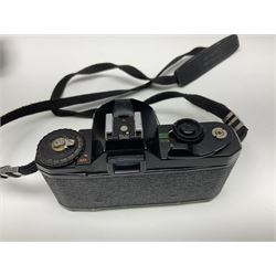 Four Minolta camera bodies, to include Dynax 500si, serial no. 94812651 with 'Signa Zoom 1;3.5-4.5 f=28-70mm' lens, Maxxum 300si, serial no. 97821665, with 'Tamron AF 80-210mm' lens and Dynax 300si, serial no 01603265'  with Minolta AF Power Zoom 35-80mm 1;4' lens, etc, together with Pantax MV1 camera bodies and other camera equipment 