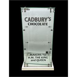 Cadbury's chocolate countertop display advertising cabinet, glazed with 'Cadbury's Makers to T.M The King & Queen', with two glass shelves and a back opening door, H54,5cm