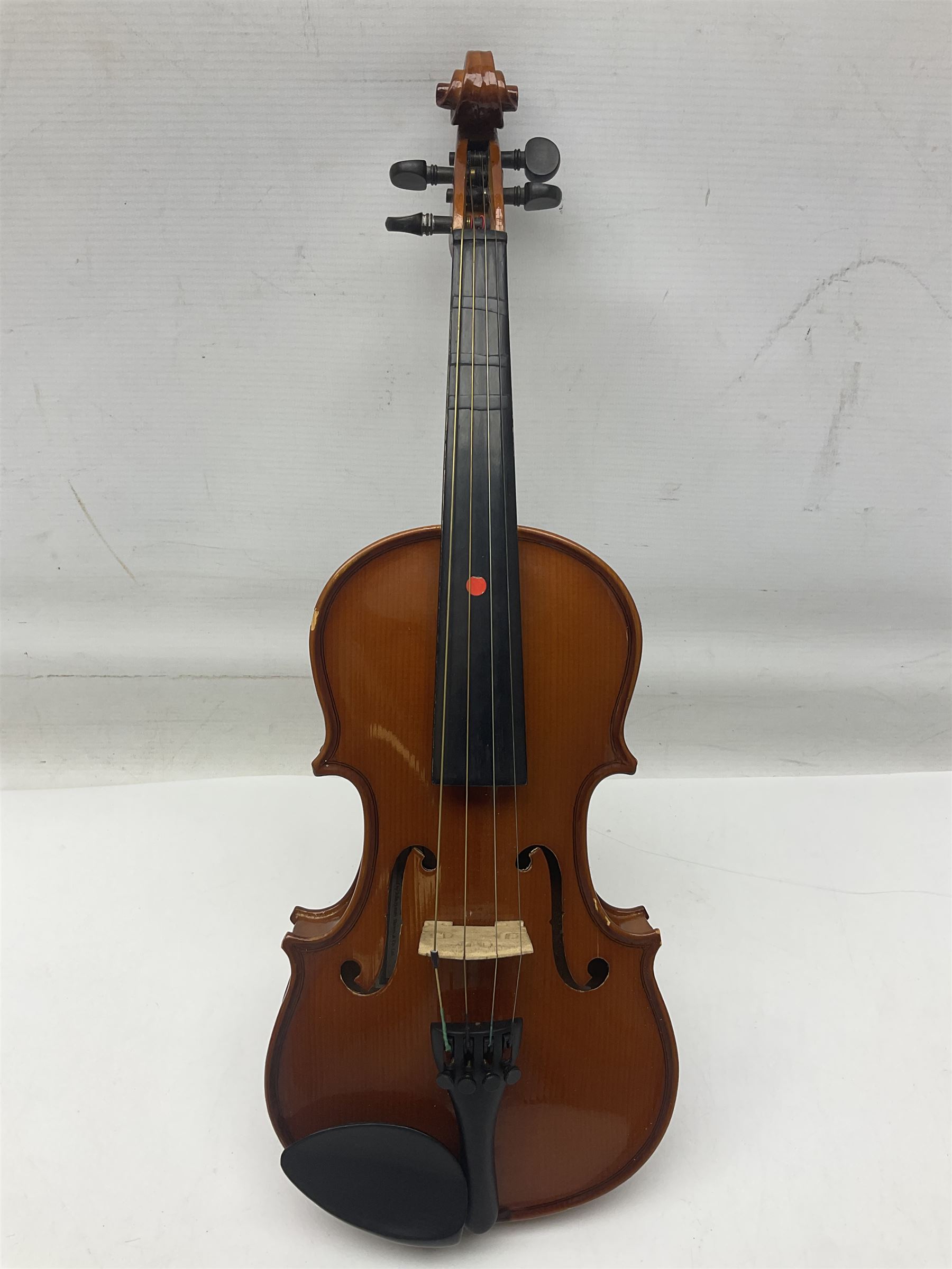 Four Chinese graduated violins - full size with 35.5cm two-piece back; three-quarter size with 33.5cm two-piece back; half size with 31cm two-piece back; and quarter size with 27.5cm two-piece back; all cased except full size; one with bow (4)