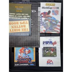 16-Bit Sega Mega Drive console with two controllers and four games, comprising Fifa 96, Sonic The Hedgehog 2, Sonic The Hedgehog Pinball and World Cup USA 94, contained within fitted plastic carrycase with instruction manual and cheats book