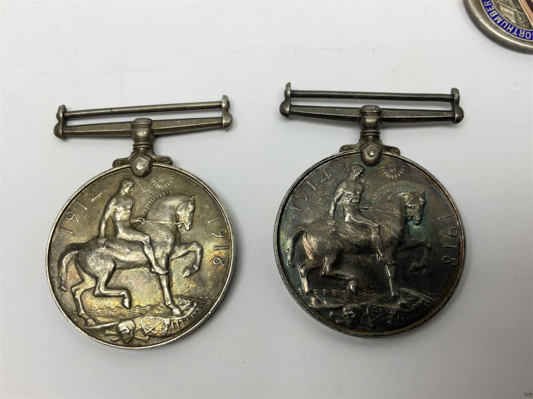 WW1 group of three medals comprising 1914-15 Star awarded to L-Cpl. W.J. Horspool R.War.R., British War Medal and Victory Medal awarded to A. Cpl. W.J. Horspool R.War.R.; WW1 British War Medal awarded to 3-8755 W.O.Cl.2. S. Paterson North'd Fus.; and hallmarked silver and enamel Northumberland Football Association Junior Cup Runners Up fob 1921-22 on silver chain (5)