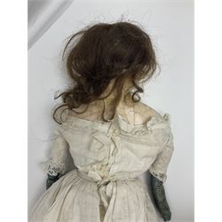 Mid-19th century large wax shoulder head doll with applied hair and inset black glass eyes, on calico body with kid leather lower arms H77cm