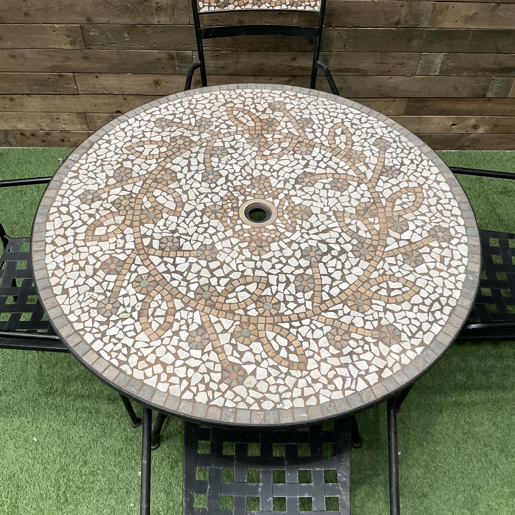 Mosaic and black metal circular garden table and four chairs