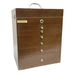 Mid 20th century portable dentist mahogany cabinet, with six glass-lined graduating drawers below a hinged lift up lid, with chrome knobs, escutcheon and carrying handle, and ivorine plaque for D. Matthews, containing a variety of tools and items relating to Dentistry, H40cm W33cm D23cm