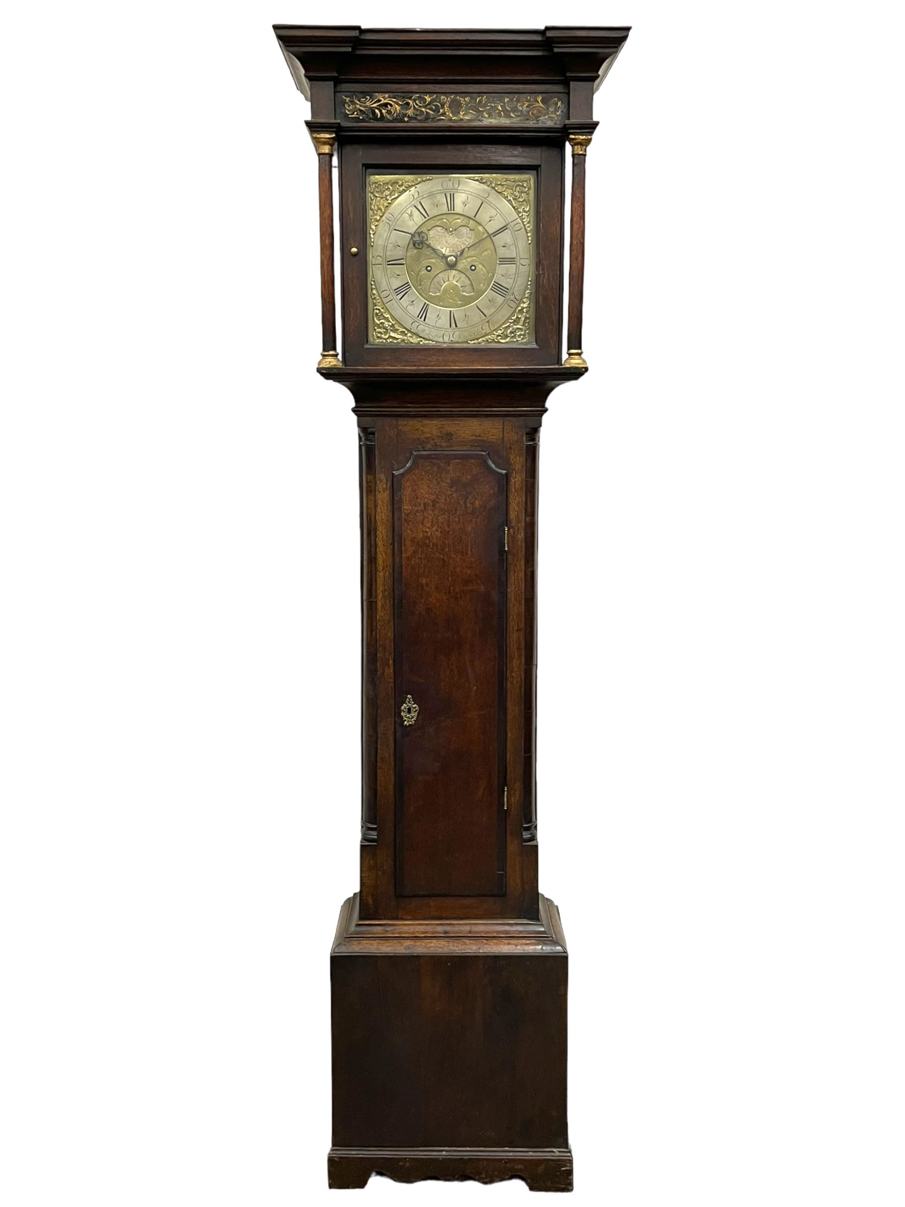 William Lister (II) of Keighley – 8-day 18th century oak cased longcase clock c1760, hood with a break front flat topped pediment and eglomise  frieze beneath, square hood door flanked by matching pilasters with gesso capitals, trunk with quarter columns and long trunk door with a flat top and convex shoulders, square plinth with a decorative skirting, 12” brass dial with rococo spandrels, engraved dial center, silvered chapter with Roman numerals, five minute Arabic’s, half hour markers and minute track, semi-circular apertures with engraved calendar and moon phase/lunar age discs, original blue steel fretted hands, four pillar rack striking movement with a recoil anchor escapement, striking the hours on a bell. With pendulum, weights and key.
The Lister family were a prolific family of clockmakers working in the West Riding of Yorkshire during the 18th century. Working in various locations including Halifax, Keighley and Luddenden.
William Lister (I) is recorded as working in Keighley from 1715-37 and his son William (II) from 1735-1785.
