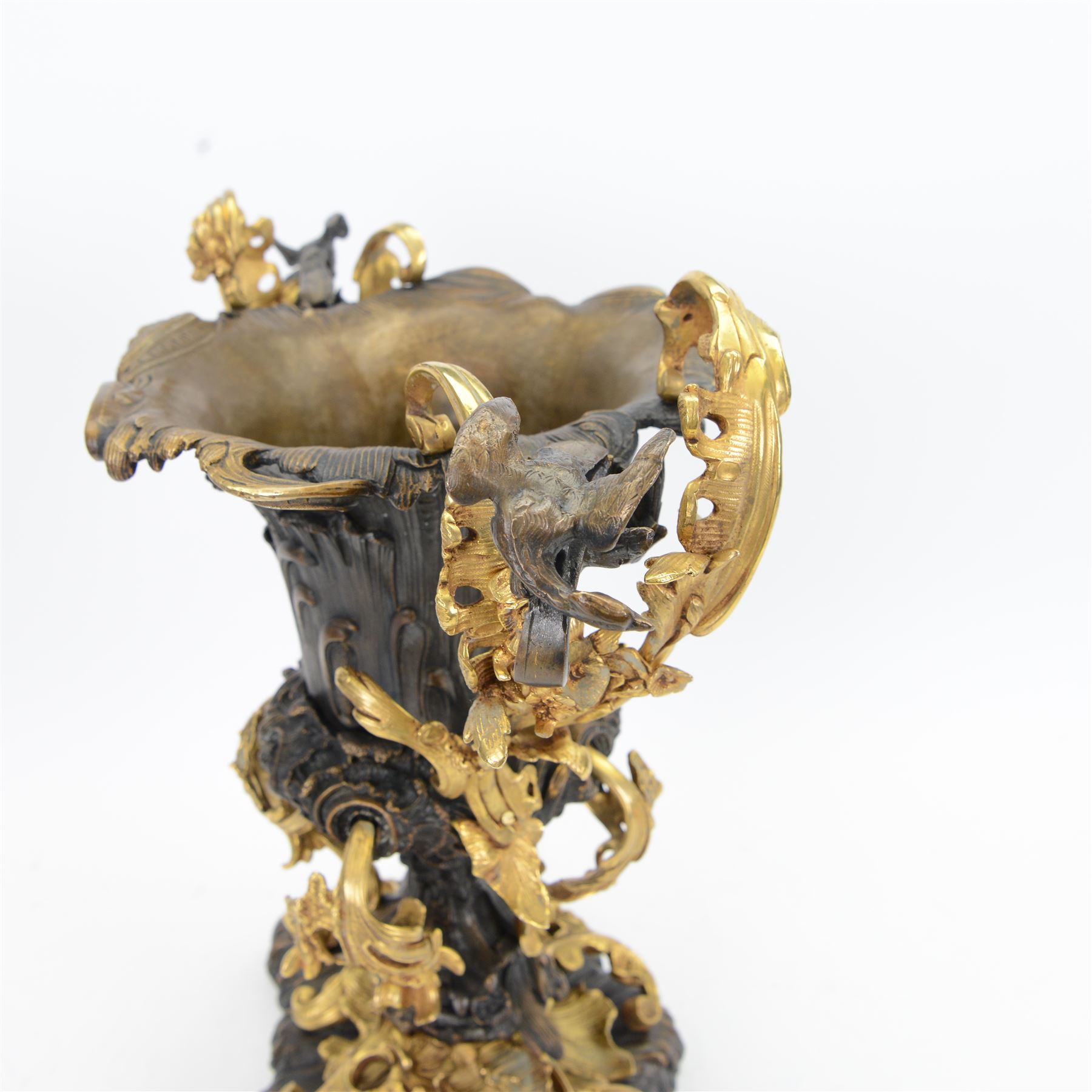 After Henry Dasson (1825-1896): large French gilt bronze urn, the body of typical form and cast with C scrolls, with twin curved gilt foliate handles detailed with birds, upon a scrolling foot, and naturalistically cast base, impressed HENRY DASSON to foot, H50.5cm W48cm