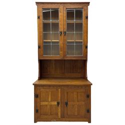 Gnomeman - adzed oak dresser, arcade carved cresting rail over two lead glazed doors, double cupboard below enclosed by two panelled doors, carved with gnome signature, by Thomas Whittaker, Little Beck 