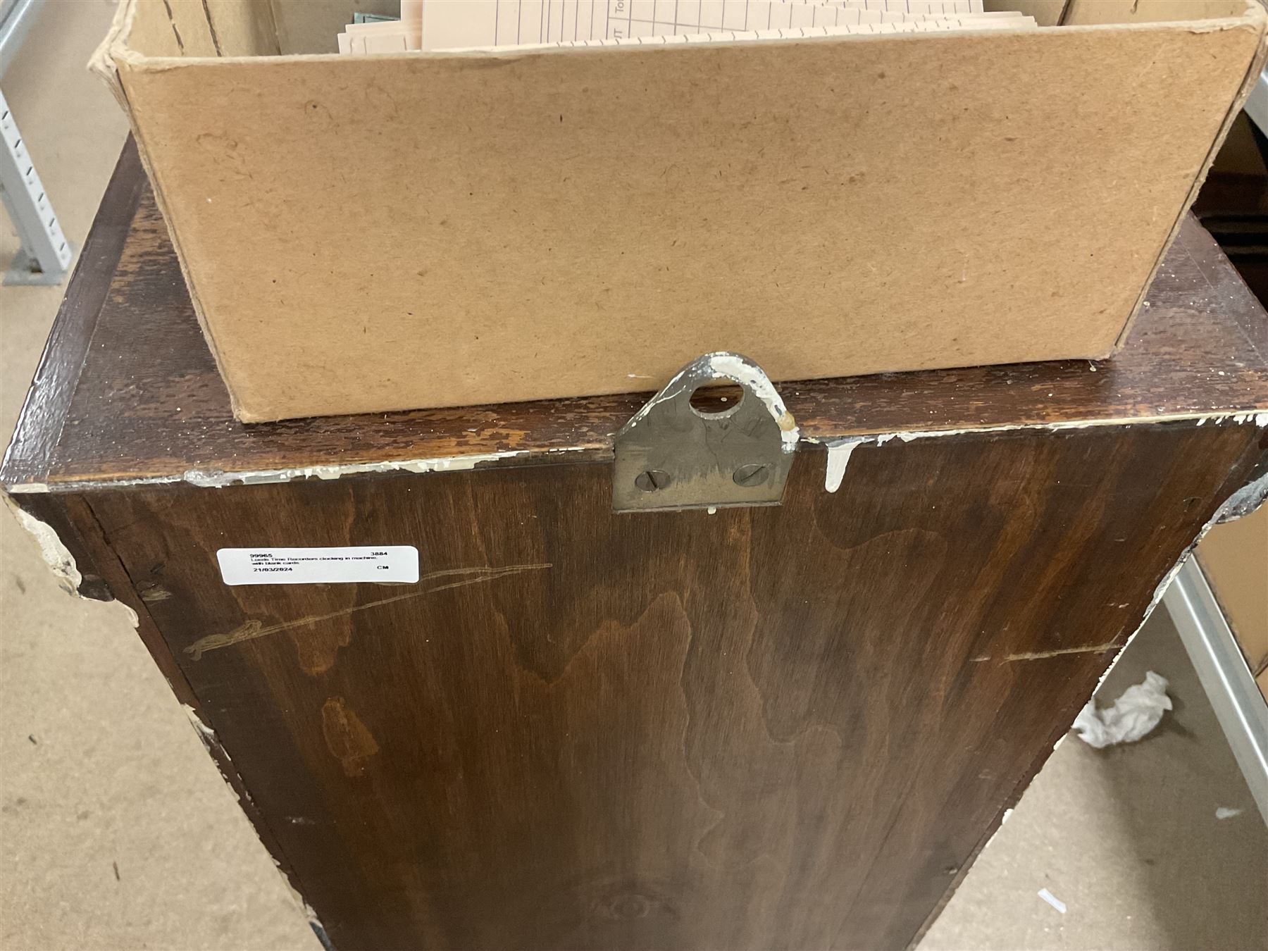 Early 20th Century Time Recorders Leeds Ltd mahogany cased clocking in machine, the square silvered dial with Arabic numerals above clocking in mechanism on plinth base, with a collection of blank clocking in cards, case H98cm