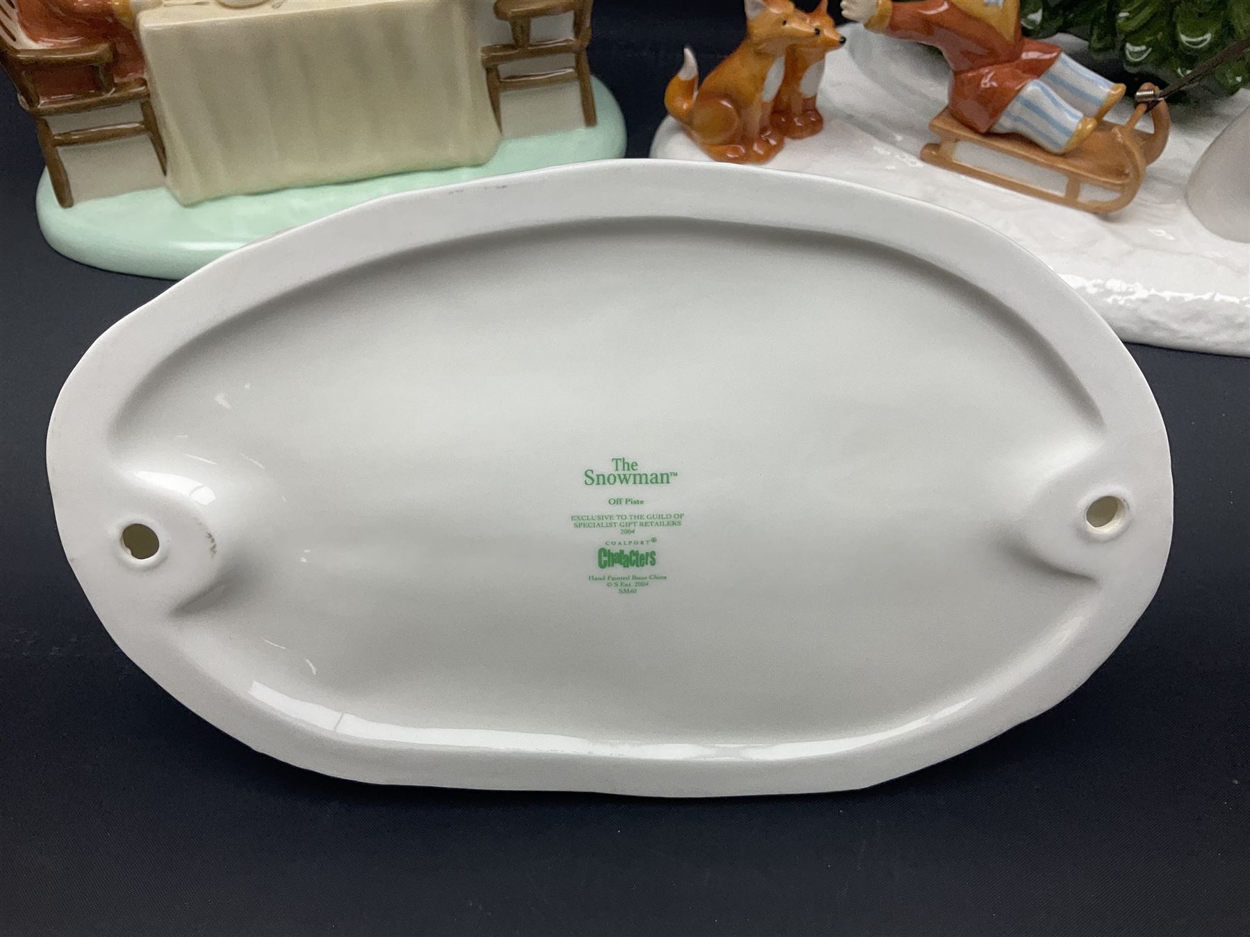 Three Coalport Characters The Snowman figures, comprising Dinner for Two, Off Piste and Winter Fun, all with certificates and original boxes 