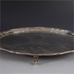 1930s silver salver, of circular form with beaded pie crust rim and upon four claw and ball feet, with presentation engraving to centre reading 'Presented to Second Lieutenant FR Himsworth Royal Signals by the Officers of the 50th Nottingham Motor Divisional Signals on the Occasion of his Marriage 10th September 1939', bordered by the engraved signatures of his colleagues, hallmarked Barker Brothers Silver Ltd, Birmingham 1938, D25cm