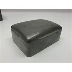 Liberty & Co Tudric pewter cigarette box, of plain rectangular form, with planished decoration to the slightly domed cover, opening to reveal a softwood interior, stamped Made in England 01234 Tudric Solkets beneath, together with another cigarette box, with applied pewter panels repousse decorated throughout with flower heads and leaves, with compartmentalised softwood interior, largest H5.5cm, W23cm