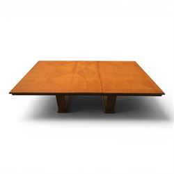 Modern Art Deco design walnut extending dining table, rectangular top with rounded moulded edge, geometric parquetry veneered panels, extending action with additional leaf extending to 220cm, on twin panelled pedestal supports with stepped plinth feet