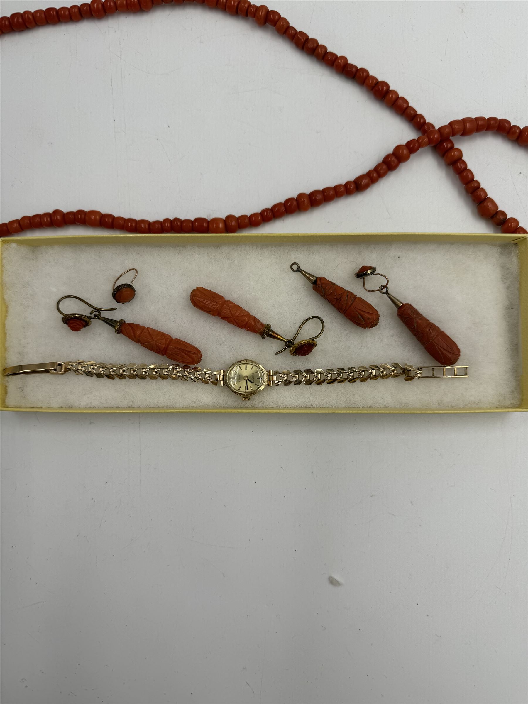 Coral bead necklace and two pairs of carved coral earrings, together with a 9ct gold ladies wristwatch with 9ct gold strap, silver bracelet and a silver pencil