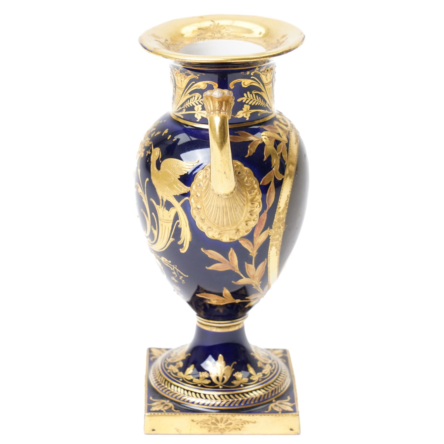 19th century Berlin porcelain urn, with twin gilt volute handles, painted with a portrait bust on cobalt blue ground and decorated profusely in gilt with classical motifs, indistinctly signed, with blue sceptre mark to base, H15cm