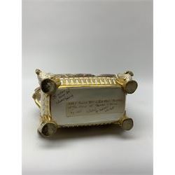 19th century Coalport bough pot, circa 1820, of bombe form, the body with twin handles surmounted by two birds and raised upon four feet modelled as swans, hand painted with two panels depicting an urn of flowers set against a mountainous landscape, the whole heightened in gilt throughout, H13cm L21cm