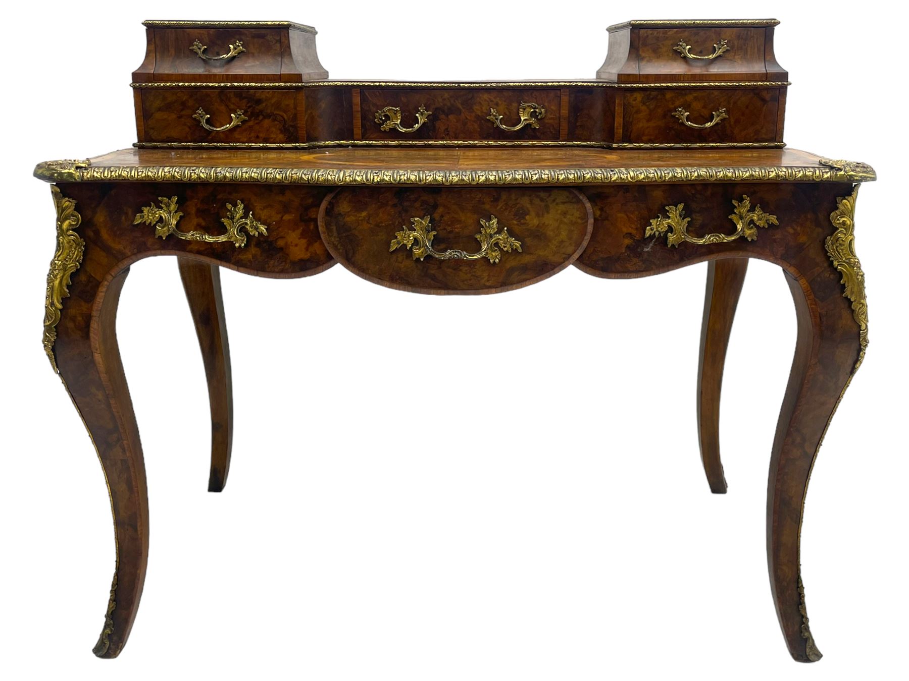 Late 19th to early 20th century French figured walnut writing desk, raised back fitted with drawers, shaped top with Kingwood banding and foliage cast edge moulding, fitted with single drawer, on cabriole supports mounted by shell and flower head cartouches 