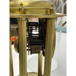 French gilt brass rotunda mantle clock under the original glass dome c1890, Parisian 8-day countwheel striking movement raised on six reeded brass pillars with a domed canopy and finial, 9-1/4” base with applied repoussé detail and polished gilt bands, 3-1/2” gilt dial with a decorative embossed centre, impressed circular Arabic numerals on a silvered background, pierced steel hands with an egg and dart chased bezel, striking the hours and half hours on a silvered bell, with the original conforming pendulum.


