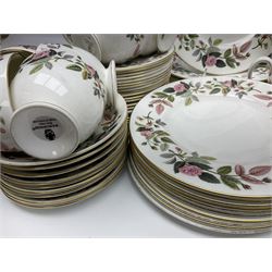 Wedgwood Hathaway Rose pattern tea and dinner wares, comprising twelve saucers, sixteen teacups, twenty tea plates, jug, sucrier, thirteen shallow bowls, sauce boat and saucer, two lidded tureens, larger jug, ten dinner plates, nine smaller plates and two large oval serving dishes