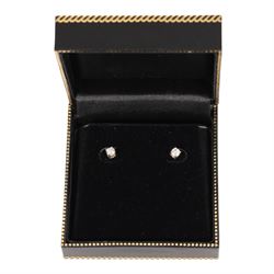 Pair of silver diamond stud earrings, boxed