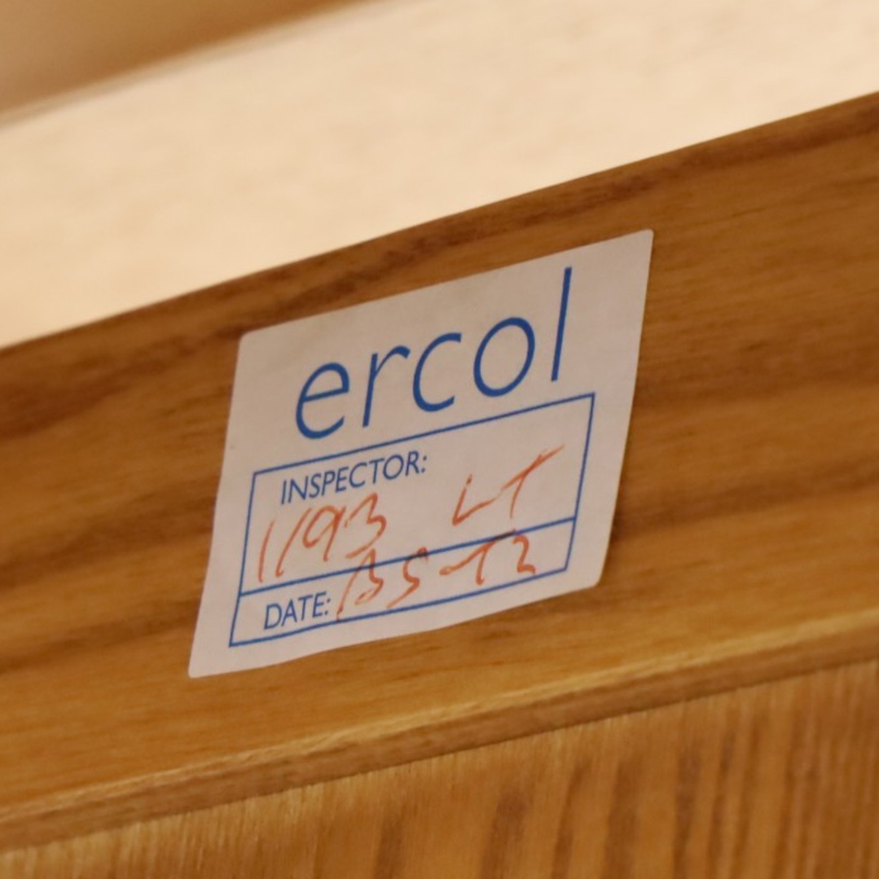 Ercol - 'Windsor' ash medium extending dining table, with stowed fold over leaf extending to 200cm, shaped supports with roundel aperture, united by a stretcher