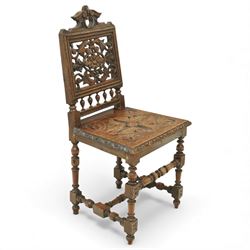 18th century carved oak hall chair, the rectangular pierced back carved with scrolling foliate ornament and central rosette beneath a shaped cresting, the boarded seat carved with stylised foliage, raised on turned legs united by stretchers