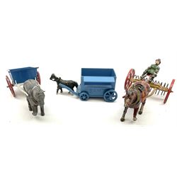 Lead figures and die-cast farm accessories including F.G. Taylor thatched cottage and rabbit hutch with rabbits; Hill & Co pig sties; haystacks; various horse drawn vehicles; two caravans; tractor; hay rake; mirrored pond; water-wheel etc