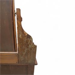 Edwardian walnut dressing chest, rectangular top surmounted by a mirror frame with shaped pediment on swing supports above two short frieze drawers over two short and three long graduated drawers fitted with brass foliate handles, raised on a plinth base
